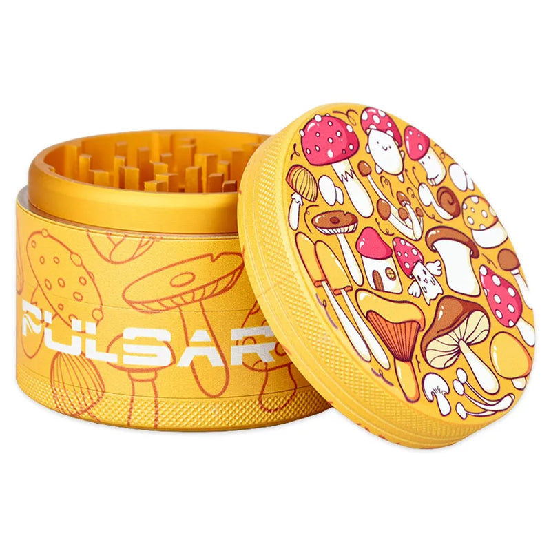 Pulsar's Design Series Metal Grinder featuring the FUNgi design, depicting a wide array of mushroom species, some with friendly smiles, with matching side art. Open grinder showcasing the magnetic lid and diamond-shaped cutting teeth second chamber.