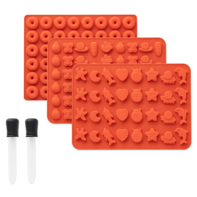 Ongrok's 3-pack of mini size silicone gummy molds. The 3 molds have various shapes and items ranging from animals to food to shapes. 2 droppers are also showcased in the photo.