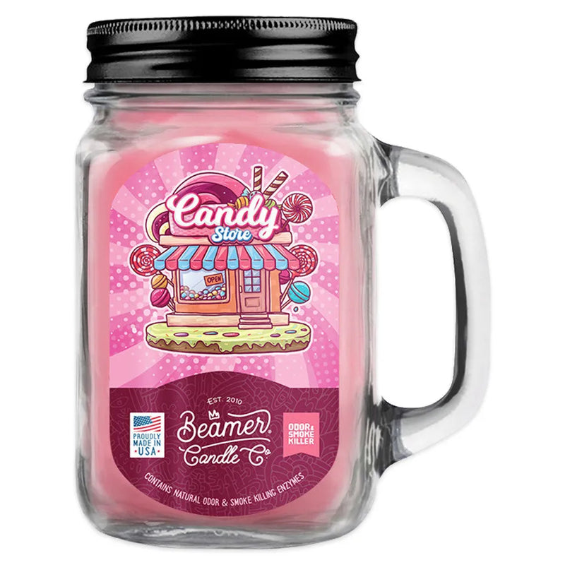 Beamer Candle Co 12oz candle in the Candy Store scent. Pink wax, glass reusable mason jar with metal lid. Pink Beamer branded sticker featuring a candy shop.