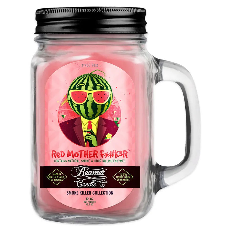 Beamer Candle Co 12oz candle in the Red Mother Fucker scent. Pink wax, reusable glass mason jar with metal lid. The Beamer branded candle features a watermelon head wearing a suit with a joint in his hand.
