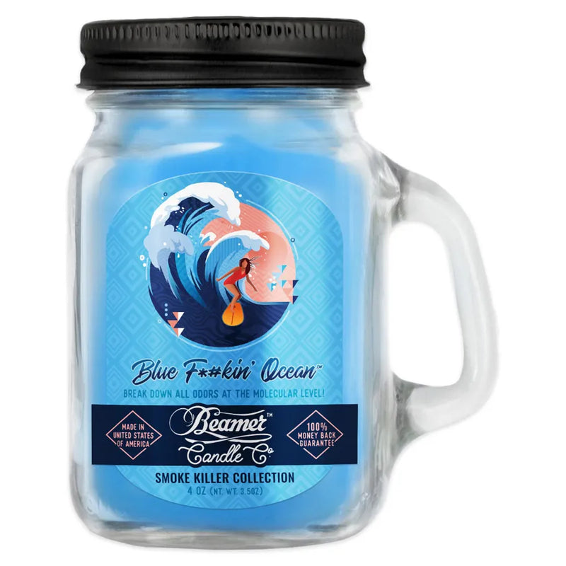 Beamer Candle Co's 4oz candle in the Blue Fucking Ocean scent. Ocean blue wax, reusable glass mason jar with metal lid. The beamer branded sticker features a girl surfing on a high wave.