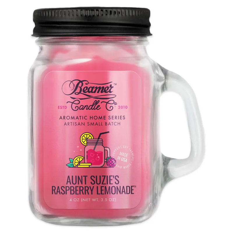 Beamer candle co's 4oz candle in the Aunt Suzie's Raspberry Lemonade scent. Pink wax, reusable glass mason jar with lid. The Beamer branded sticker features a fresh looking mason jar full of pink lemonade.