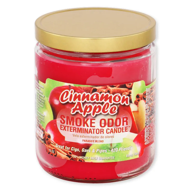 Smoke Odor's 13oz Exterminator Candle in the Cinnamon Apple Scent. A deep red wax colour, gold lid, and vibrant sticker label with various apples and cinnamon sticks