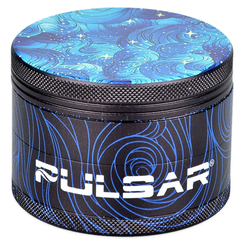 Pulsar's Design Series Metal Grinders feature the Space Dust design, depicting an ever-flowing blue depth lit by distant sparkling stars, with matching side art. Closed grinder.