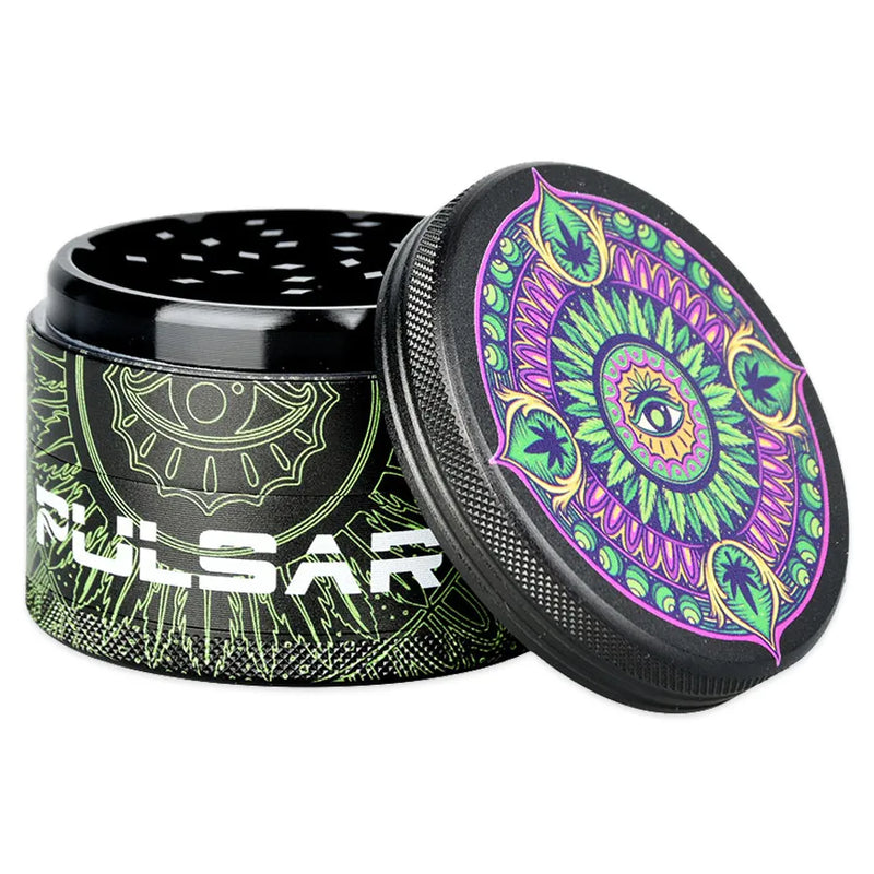 Pulsar's Design Series Metal Grinder featuring the Hemp Mandala design, depicting a hemp leaf mandala with a watchful eye at the center, with matching side art. Open grinder showcasing the magnetic lid and diamond-shaped cutting teeth second chamber.