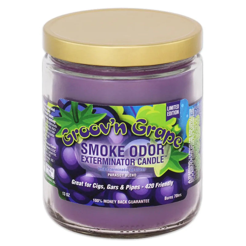 Smoke Odor's 13oz jar candle in a Groov'n Grape scent. Purple wax, gold lid, glass jar. The Smoke Odor branded sticker features various cartoon grapes.