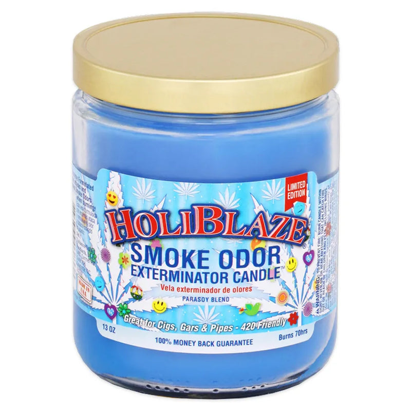 Smoke Odor's 13oz candle in a HoliBlaze scent. Light blue coloured wax, gold lid, glass jar. The Smoke Odor branded sticker features various white weed leaves, smiley faces, and winter themed decals.