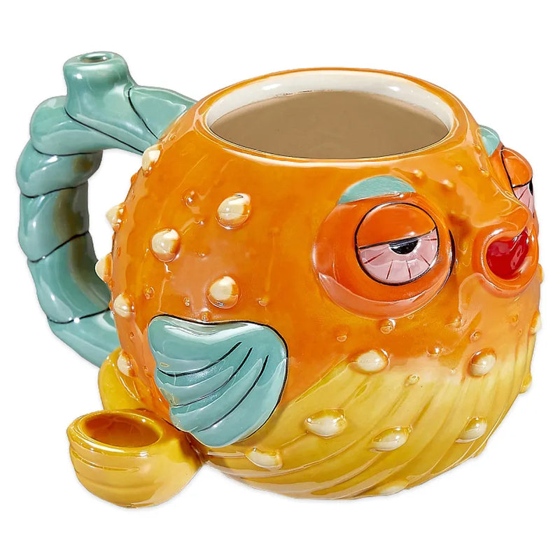 The pufferfish mug pipe is fully functional with a pipe and mouthpiece. Holds 20oz. of liquid. Designed as a brightly coloured stone pufferfish with bloodshot eyes and a pearlized finish adding to the glazed-over expression of the fish.