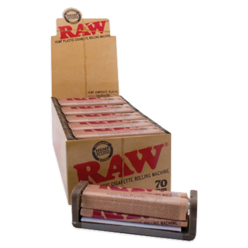 RAW Single Wide Rolling Machines. Open retail display box of 12 rolling machines. Hemp plastic construction with a RAW branded apron.