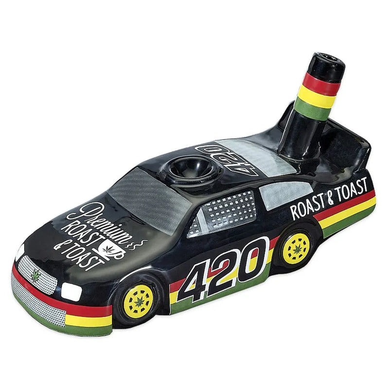 A ceramic race car pipe adorned with 420 Rasta accents throughout.