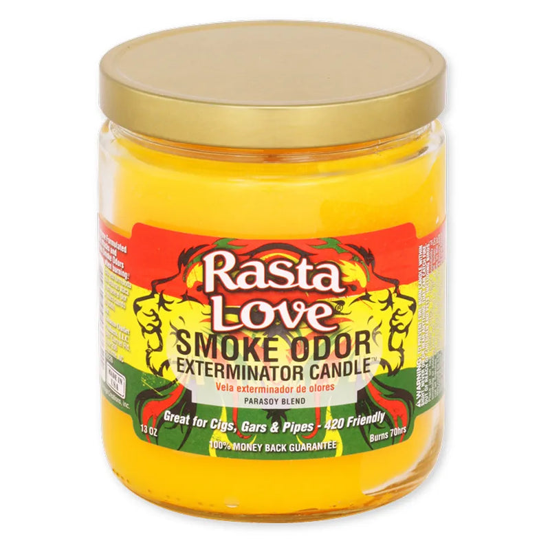 Smoke Odor's 13oz Exterminator Candle in the Rasta Love scent. Deep yellow, almost orange wax colour. The sticker label has a rasta red yellow green colour with two lions facing away from each other.