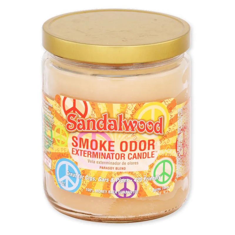 Smoke Odor's 13oz Jar Candle in a Sandalwood Scent. Beige coloured wax, gold lid, glass jar. The Smoke Odor branded sticker features an orange background with various assorted coloured peace symbols and peace written all through out.
